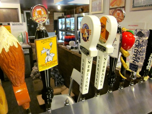 A line of taps, tables to partake of them, and refrigerators full of yummy bottles to try at home.