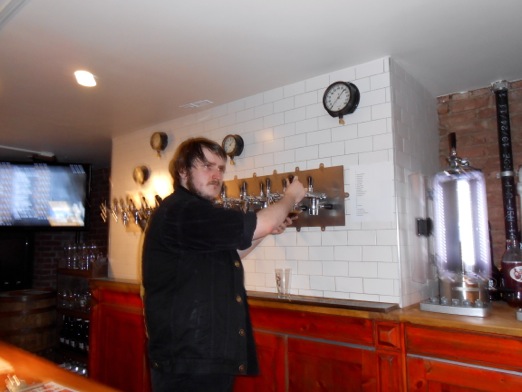 The erstwhile Alex, working the taps