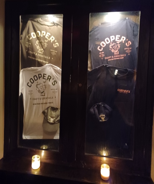 Merch and Candles by the washbasin